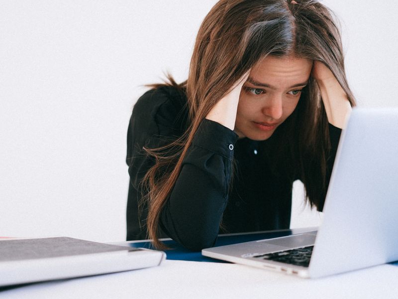Person searching public records on a laptop